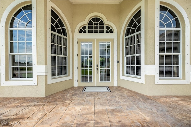 property entrance with french doors and a patio area