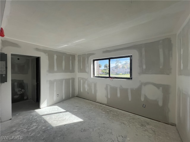 spare room featuring concrete floors