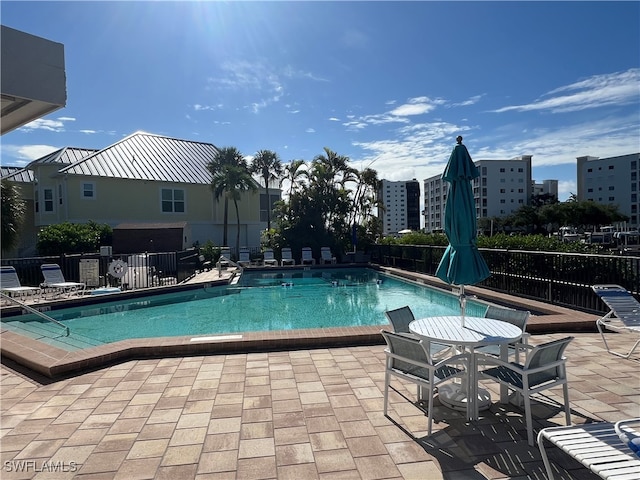 view of swimming pool with a patio area