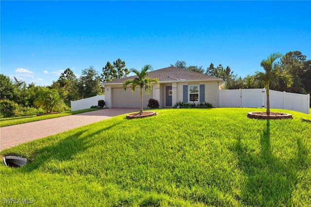 ranch-style home featuring a garage and a front yard