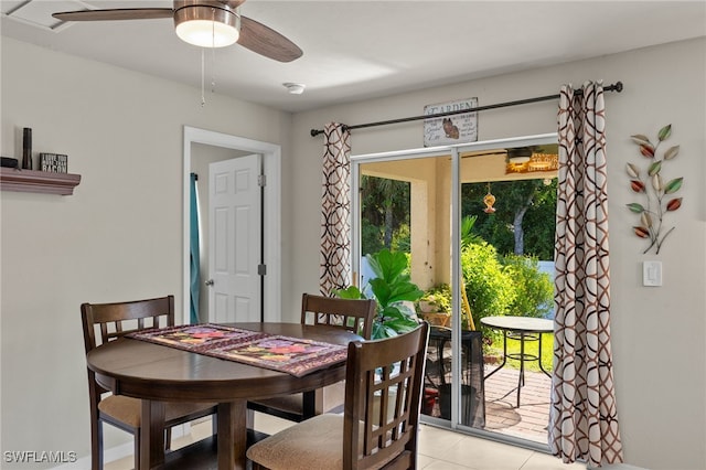 dining room with ceiling fan, light tile patterned flooring, and a healthy amount of sunlight