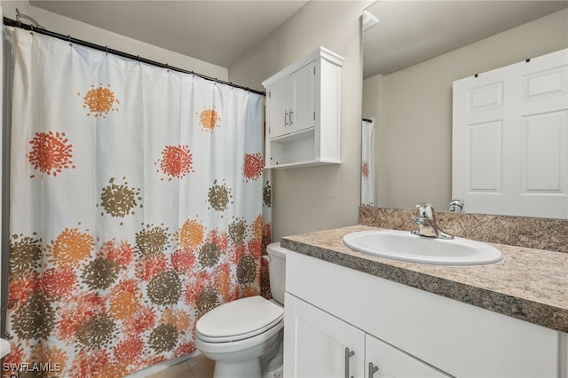 bathroom with toilet and vanity