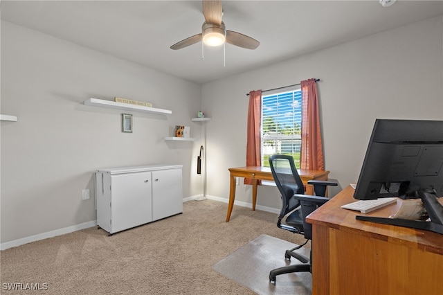 office space featuring ceiling fan and light carpet