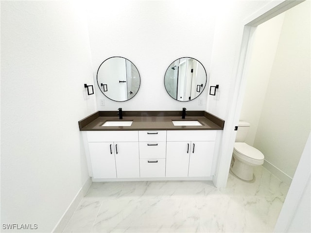 bathroom with toilet and vanity