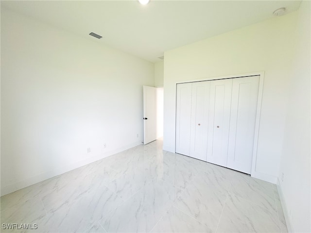 unfurnished bedroom featuring a closet