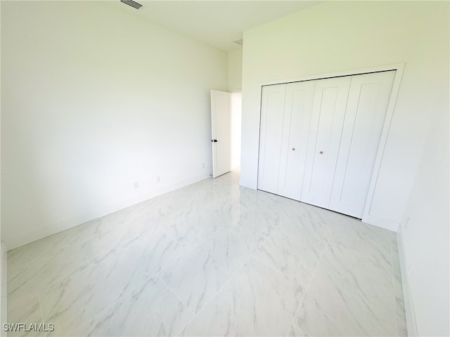 unfurnished bedroom with a closet