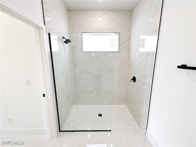 bathroom featuring a tile shower