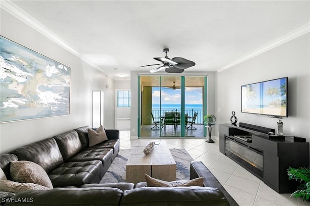 tiled living room featuring ceiling fan and crown molding