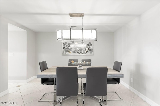 dining area with light tile patterned flooring