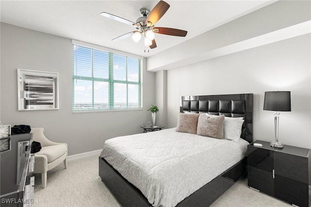 bedroom featuring ceiling fan and light colored carpet