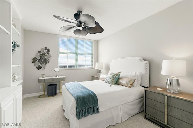 bedroom with light carpet and ceiling fan