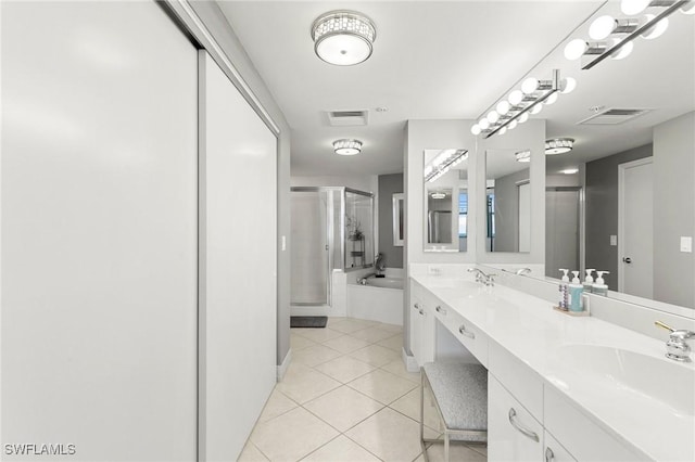 bathroom featuring tile patterned floors, vanity, and separate shower and tub