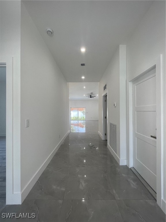 corridor featuring tile patterned flooring