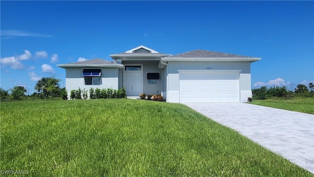 view of front facade with a front lawn and a garage