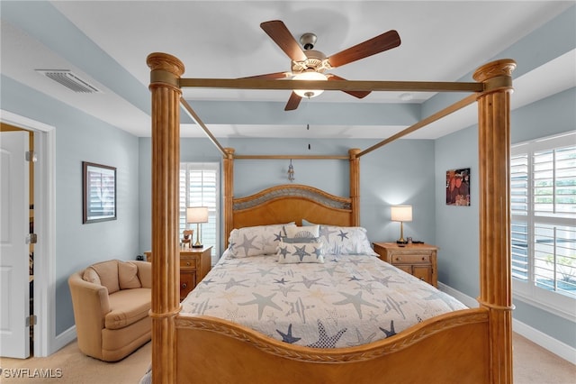 bedroom with ceiling fan and light carpet