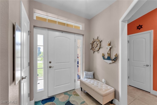 entryway featuring light tile patterned flooring