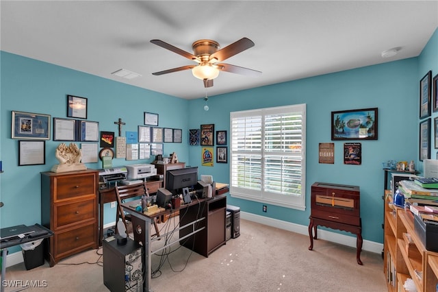 home office with light carpet and ceiling fan