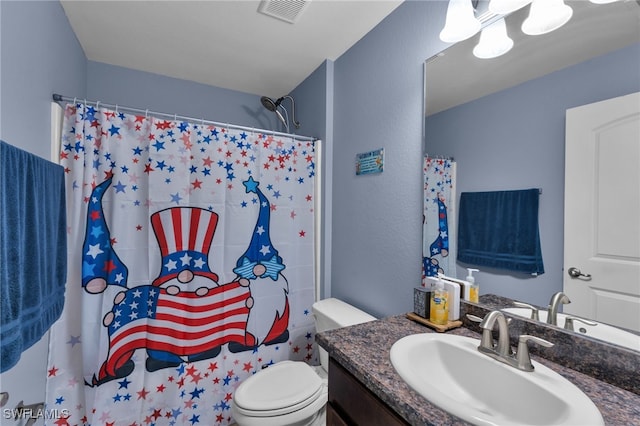 bathroom with toilet and vanity