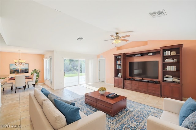 tiled living room with ceiling fan with notable chandelier and vaulted ceiling