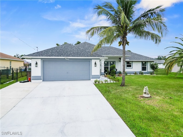 ranch-style home with a garage and a front lawn