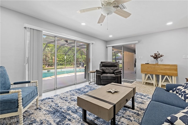 carpeted living room featuring ceiling fan