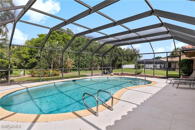 view of pool featuring a patio area and a lanai