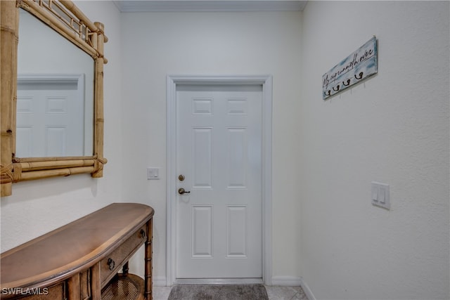 doorway to outside with light tile patterned floors