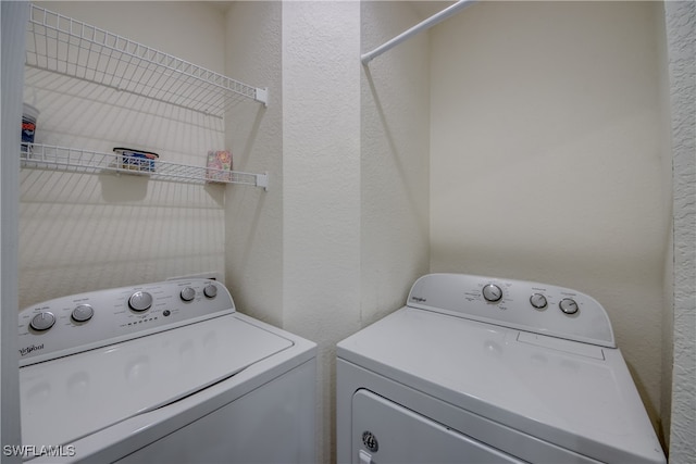 washroom featuring independent washer and dryer