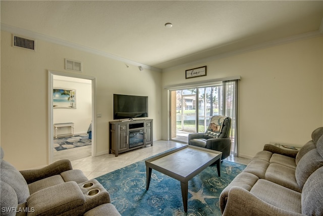 living room featuring crown molding, a fireplace, and light tile patterned floors