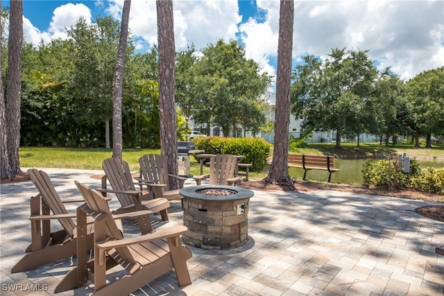 view of patio / terrace featuring a fire pit