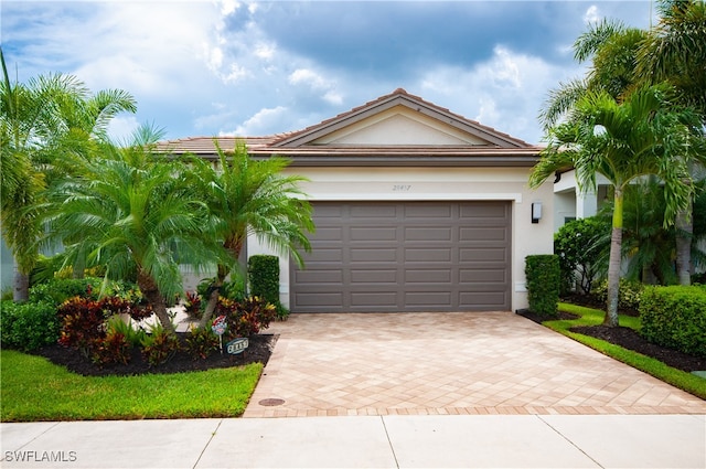 single story home featuring a garage