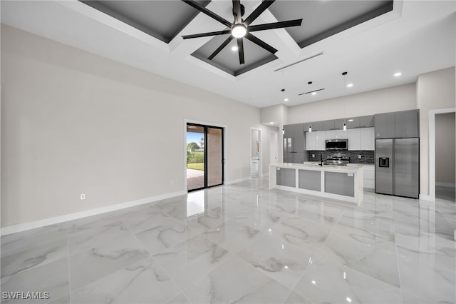 interior space featuring light tile patterned floors, beamed ceiling, coffered ceiling, and ceiling fan