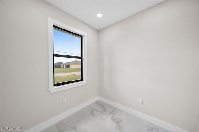 spare room featuring tile patterned flooring