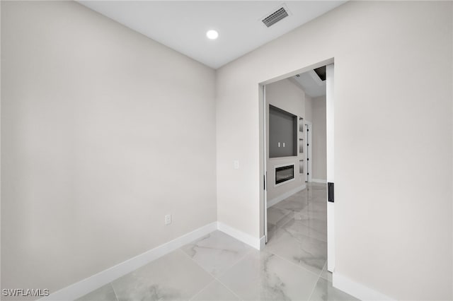 hallway featuring tile patterned floors