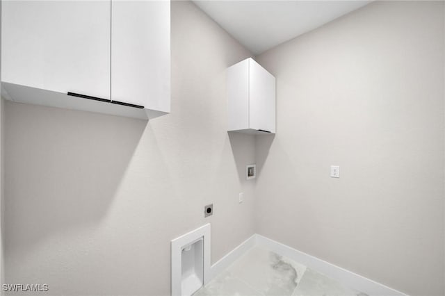 clothes washing area with hookup for a washing machine, hookup for an electric dryer, baseboards, marble finish floor, and cabinet space