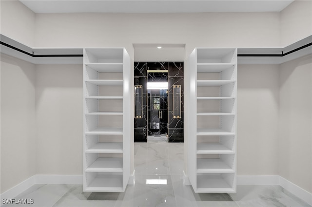 walk in closet featuring tile patterned flooring