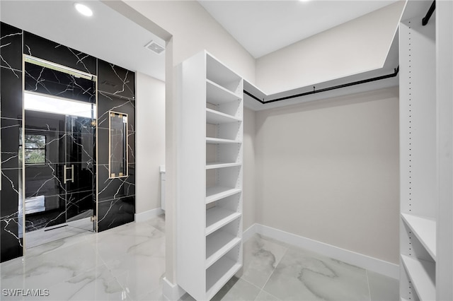 walk in closet featuring tile patterned floors