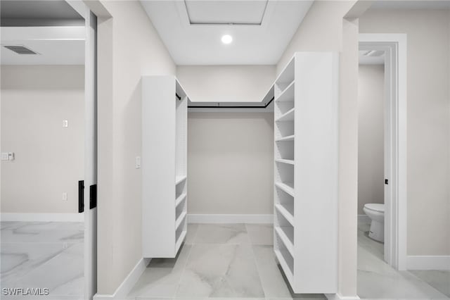 walk in closet featuring light tile patterned floors