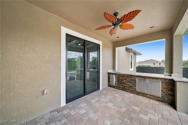 view of patio with ceiling fan