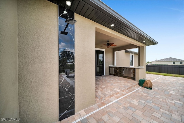 view of patio / terrace featuring ceiling fan