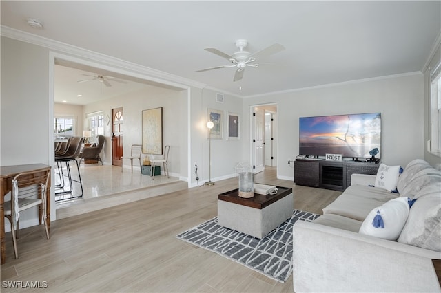 living room with ceiling fan, light hardwood / wood-style floors, and ornamental molding