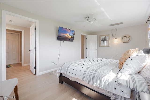 bedroom featuring ceiling fan and light hardwood / wood-style flooring