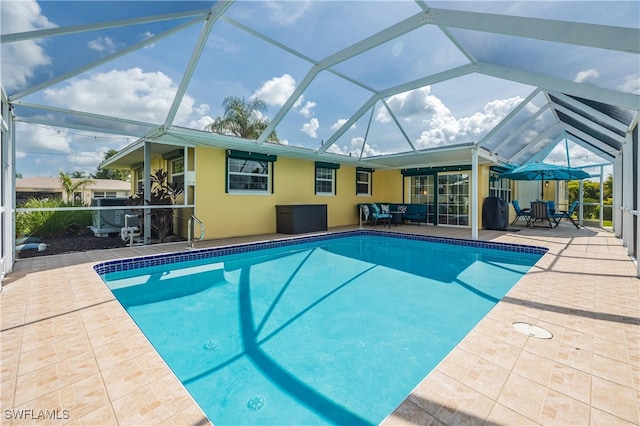 view of pool featuring a patio area and a lanai