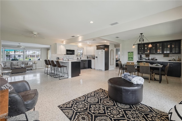 living room with ceiling fan