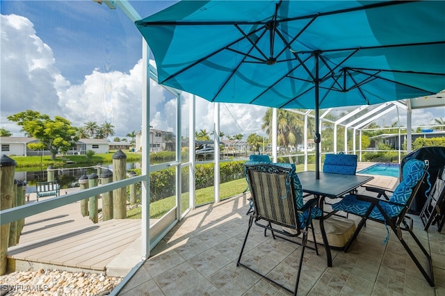 sunroom with a water view