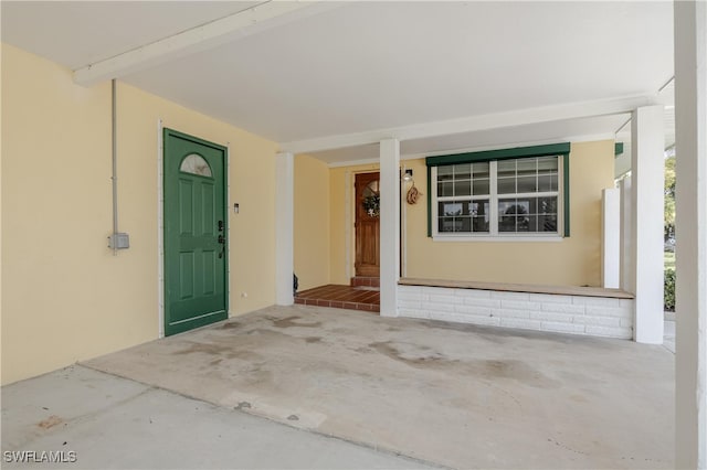 doorway to property featuring covered porch