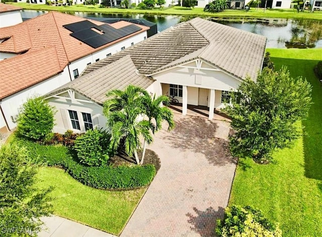 drone / aerial view with a residential view and a water view