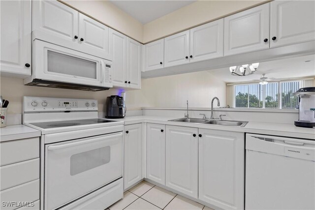 14831 Park Lake Dr Unit 309, Fort Myers, FL 33919 - kitchen with white cabinets, a sink, light countertops, white appliances, and light tile patterned flooring