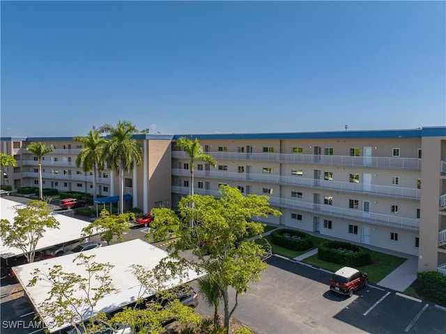 14831 Park Lake Dr Unit 309, Fort Myers, FL 33919 - view of building exterior featuring uncovered parking