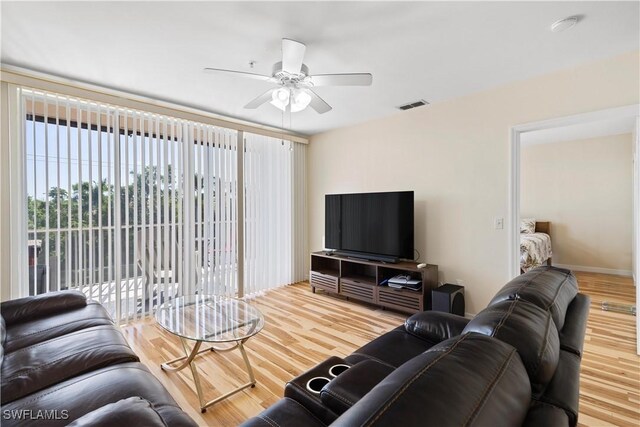 14831 Park Lake Dr Unit 309, Fort Myers, FL 33919 - living area with wood finished floors, ceiling fan, and visible vents